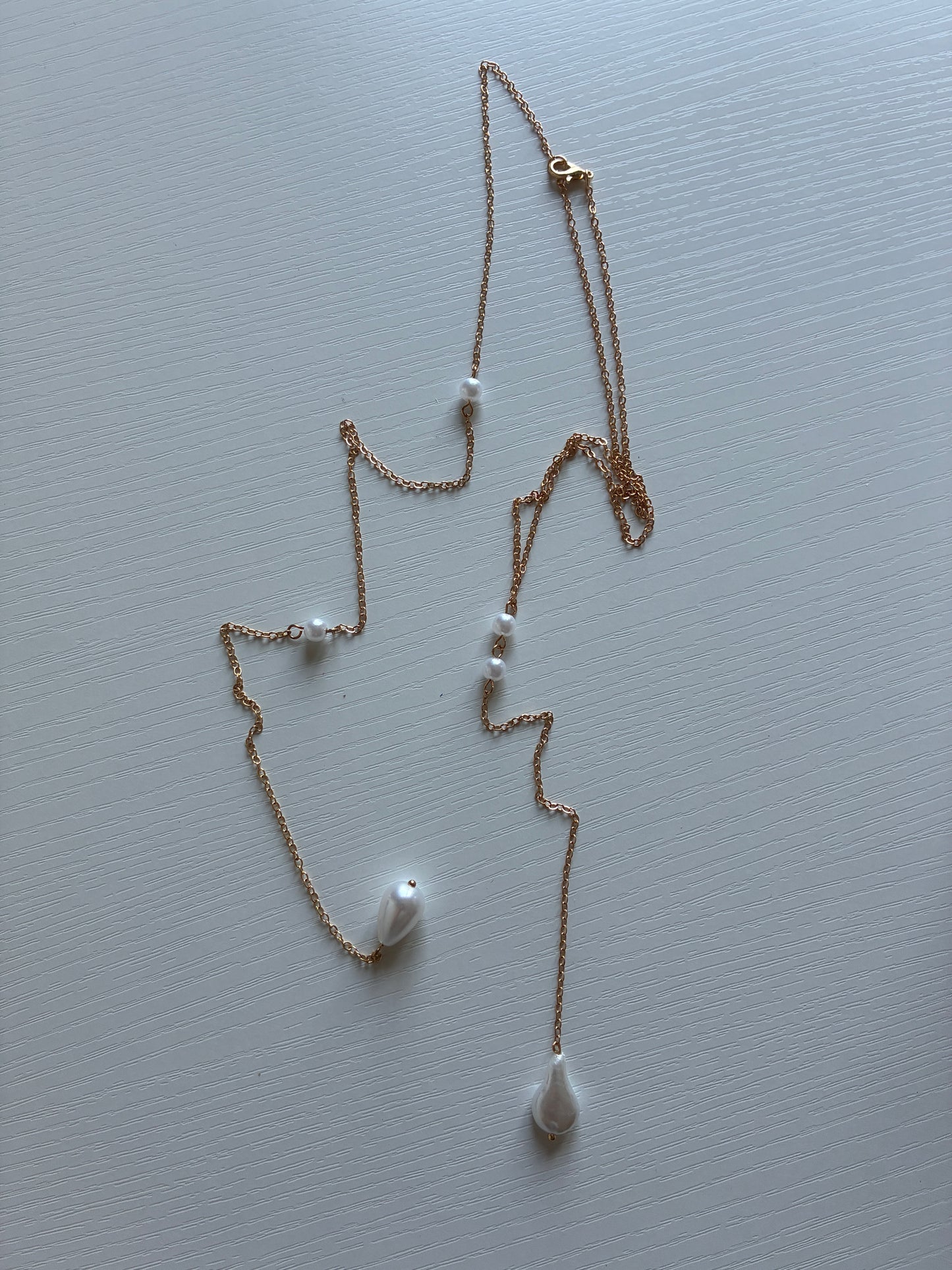 Collier de dos doré perles