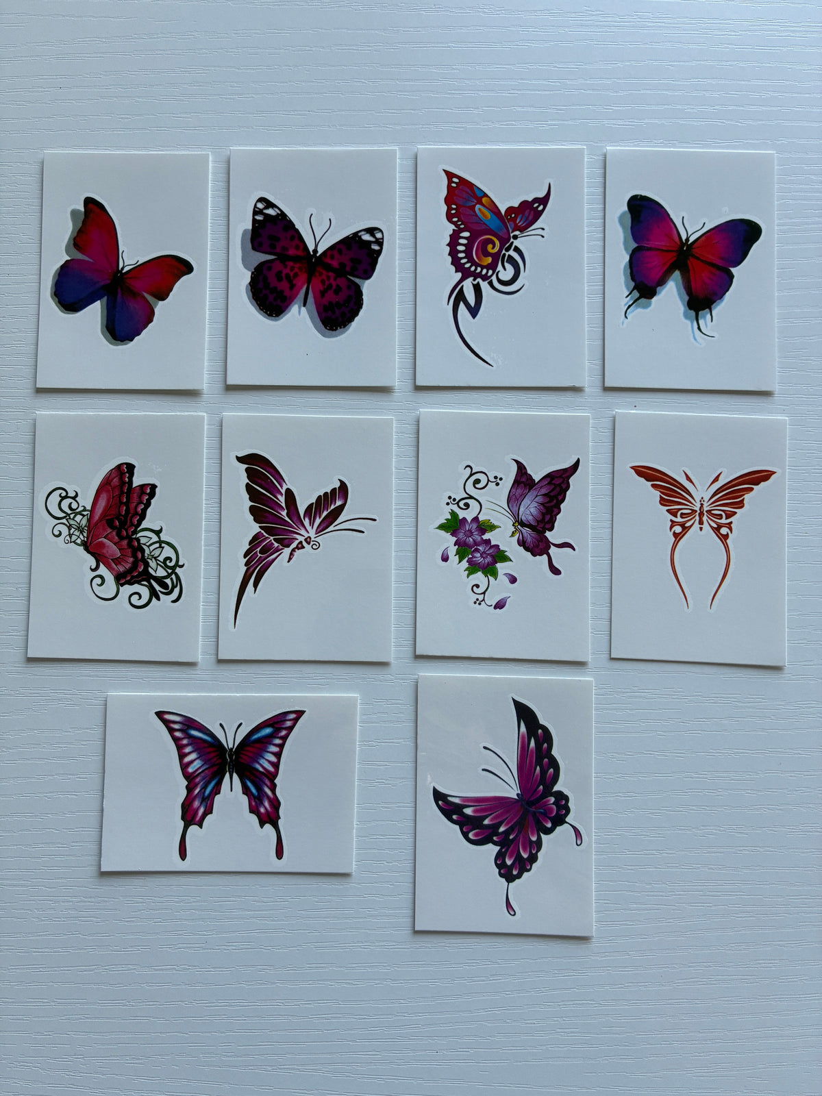 Lot de 10 tatouages éphémères Papillons – Rose, violet & bleu