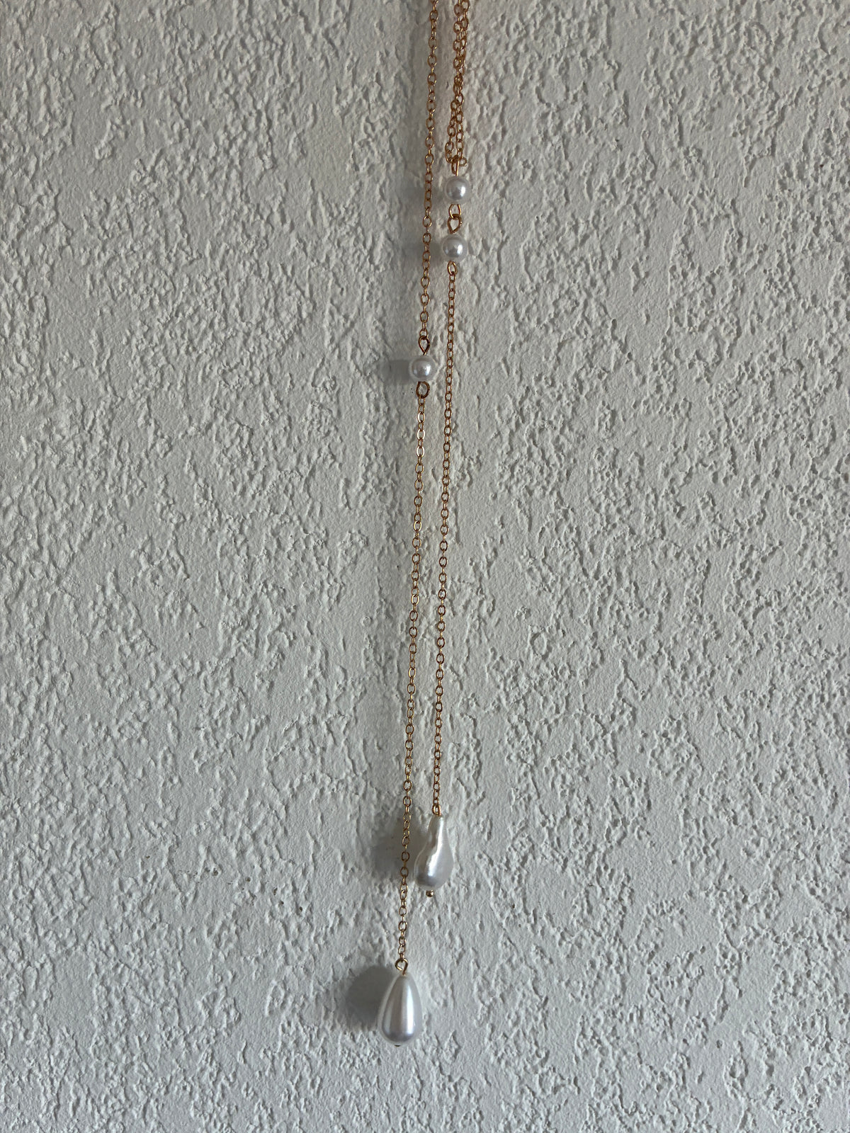 Collier de dos doré perles