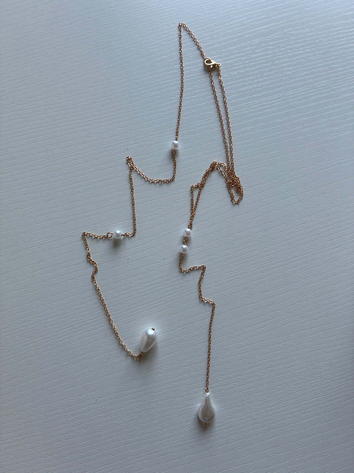 Collier de dos doré perles