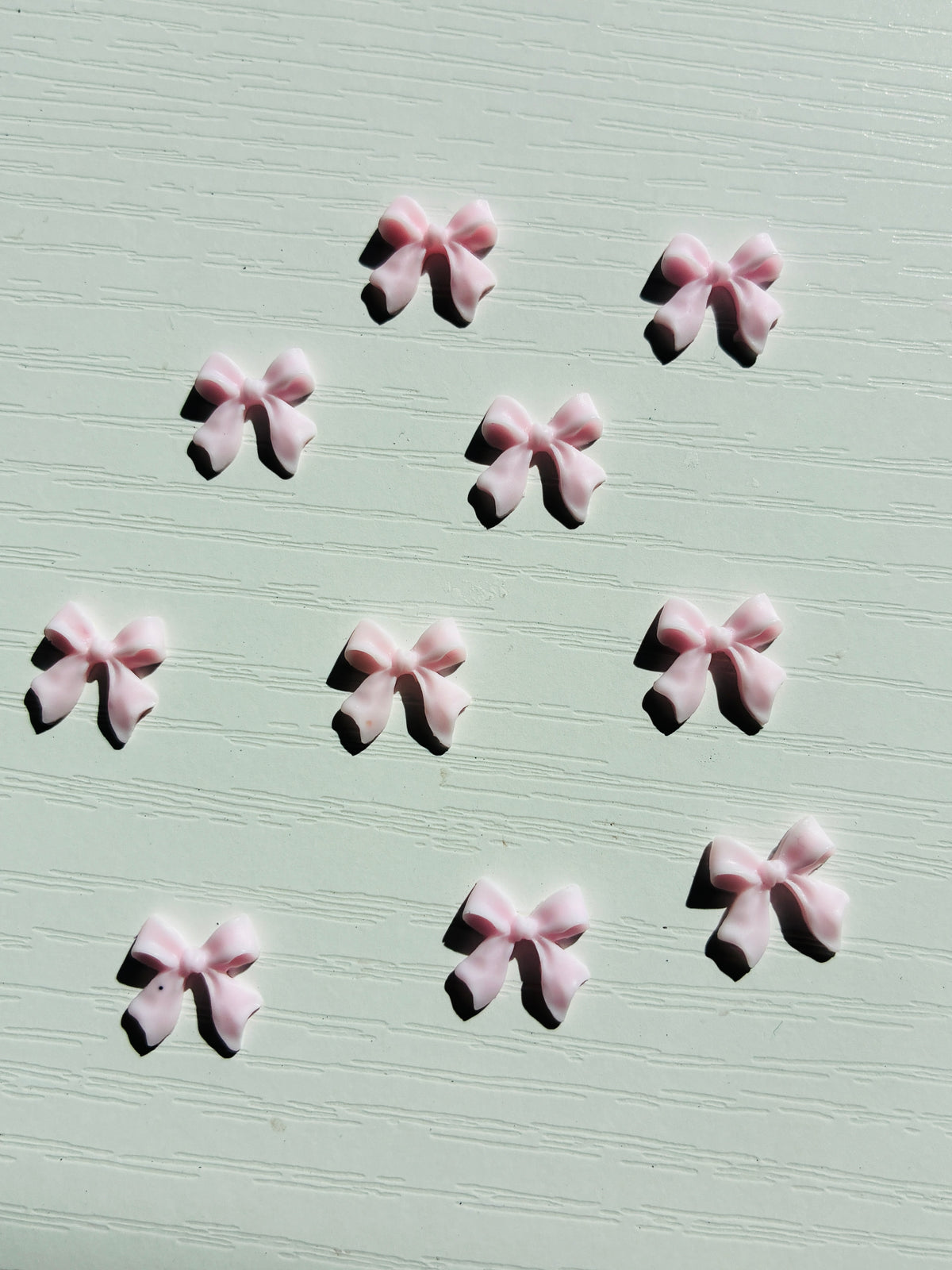 Bijoux d’ongles 3D – Nœuds roses clairs – Lot de 10