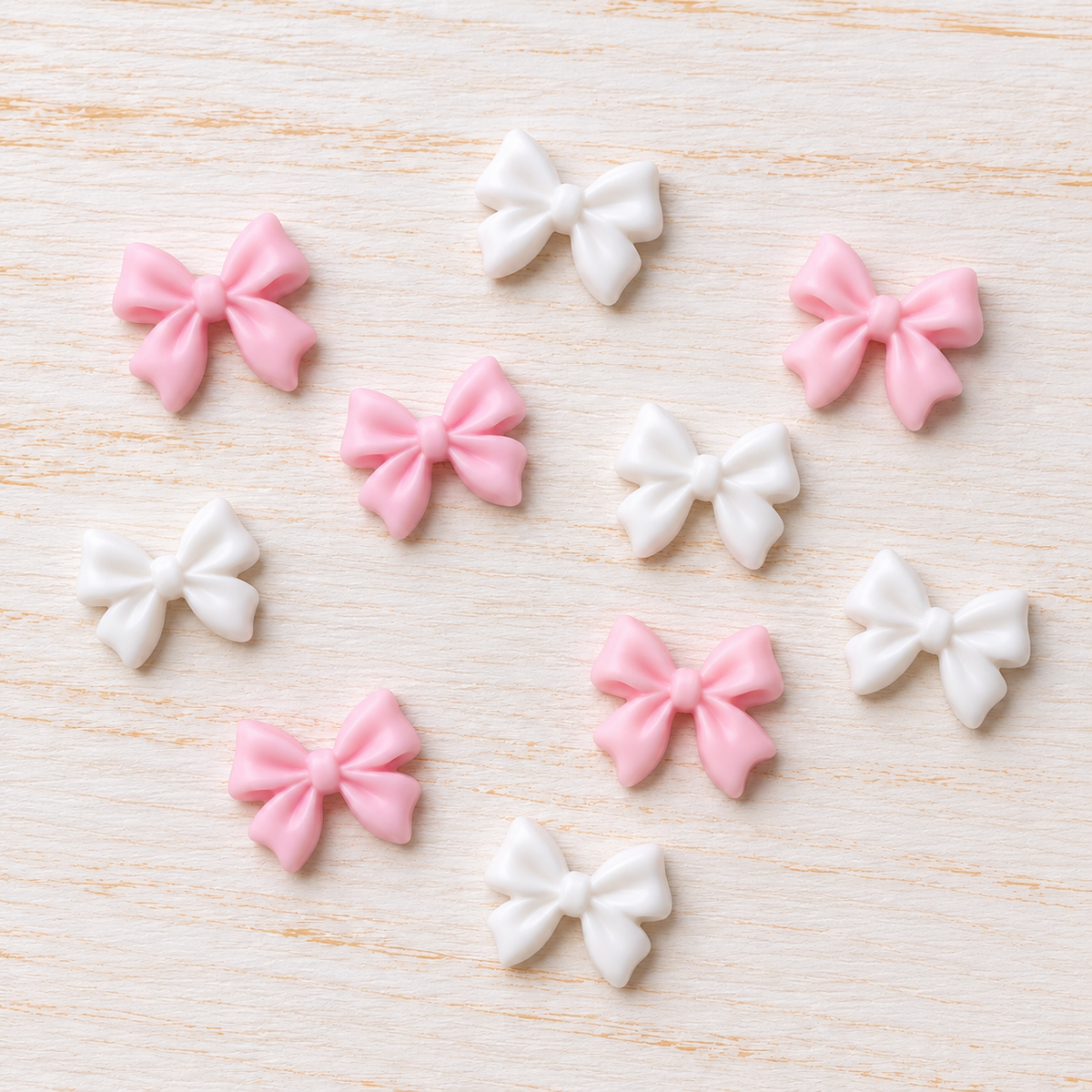 Bijoux d’ongles 3D – Nœuds rose clair et blancs – Lot de 10
