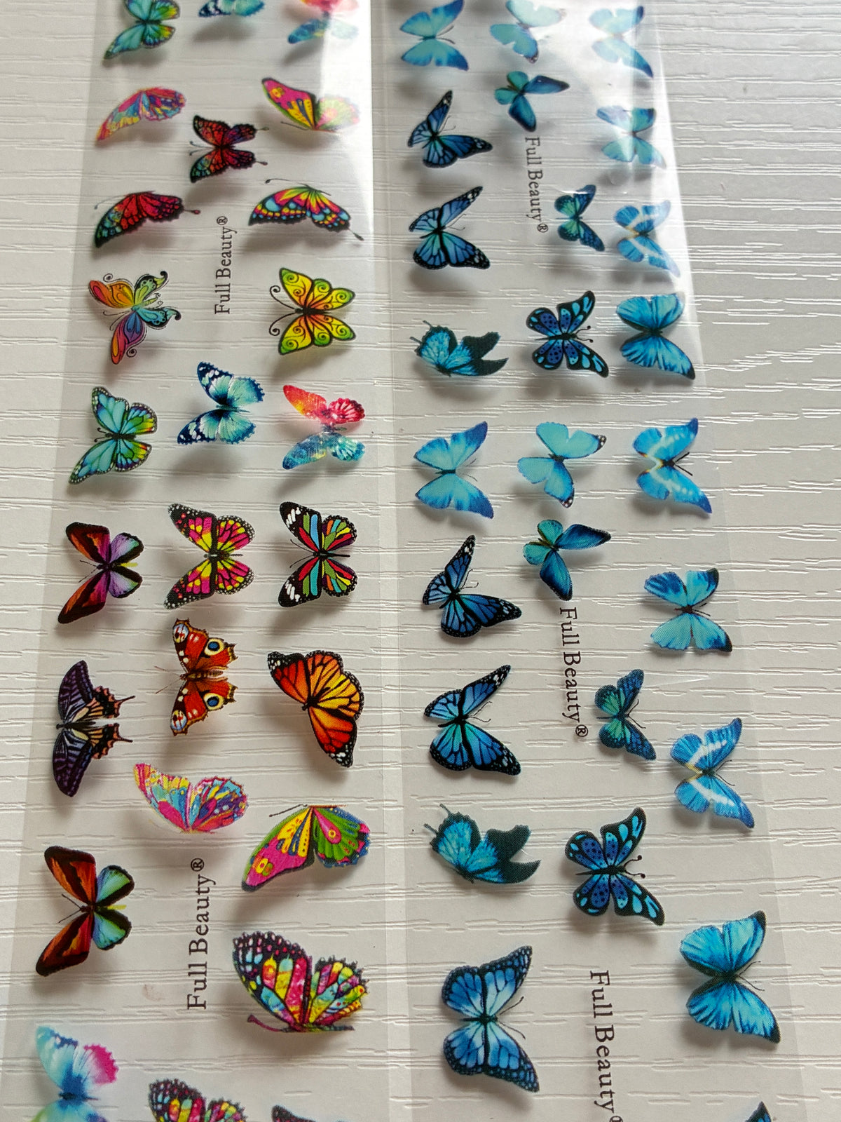 Foils Nail Art – Papillons bleus et multicolores – Lot de 2