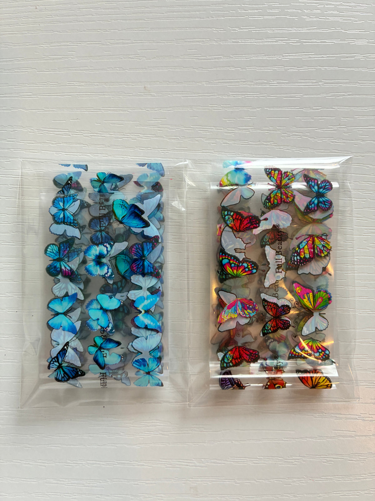 Foils Nail Art – Papillons bleus et multicolores – Lot de 2